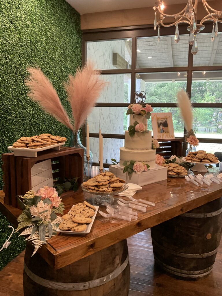 wedding venue dessert table with wedding cake