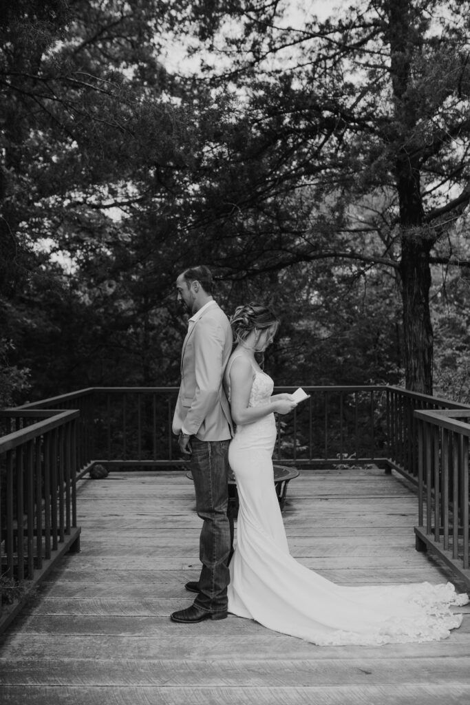 professional photo of bride and groom reading vows at the Black Oak